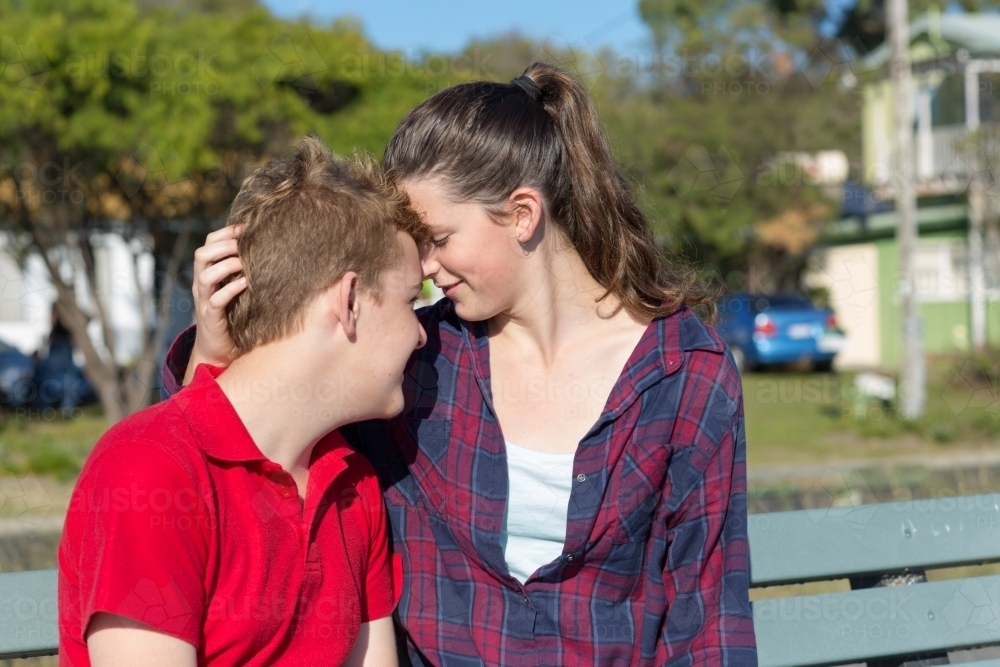 Young couple in tender moment outdoors - Australian Stock Image