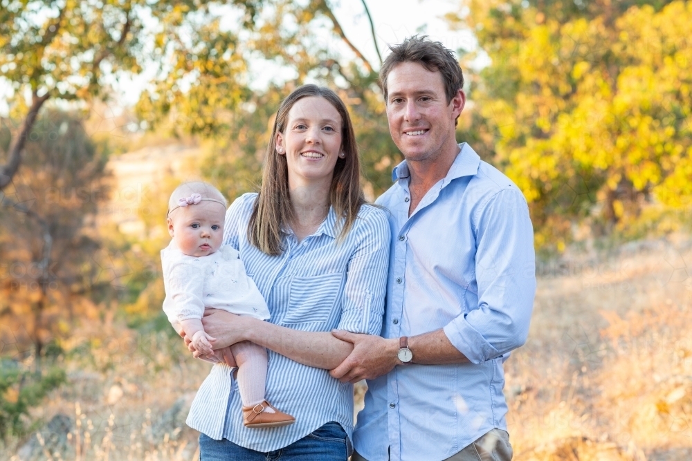 Young couple outdoors with their baby girl - Australian Stock Image