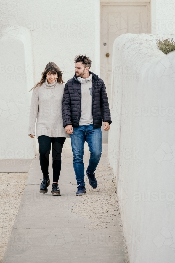 Young couple walking outdoors. - Australian Stock Image