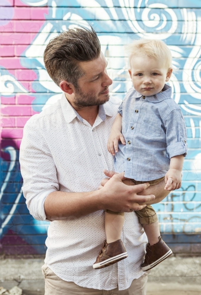 Young Dad holding his son - Australian Stock Image