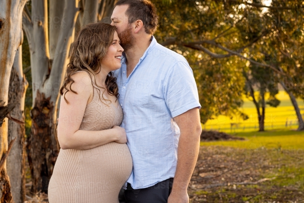 young expectant couple outdoors - Australian Stock Image