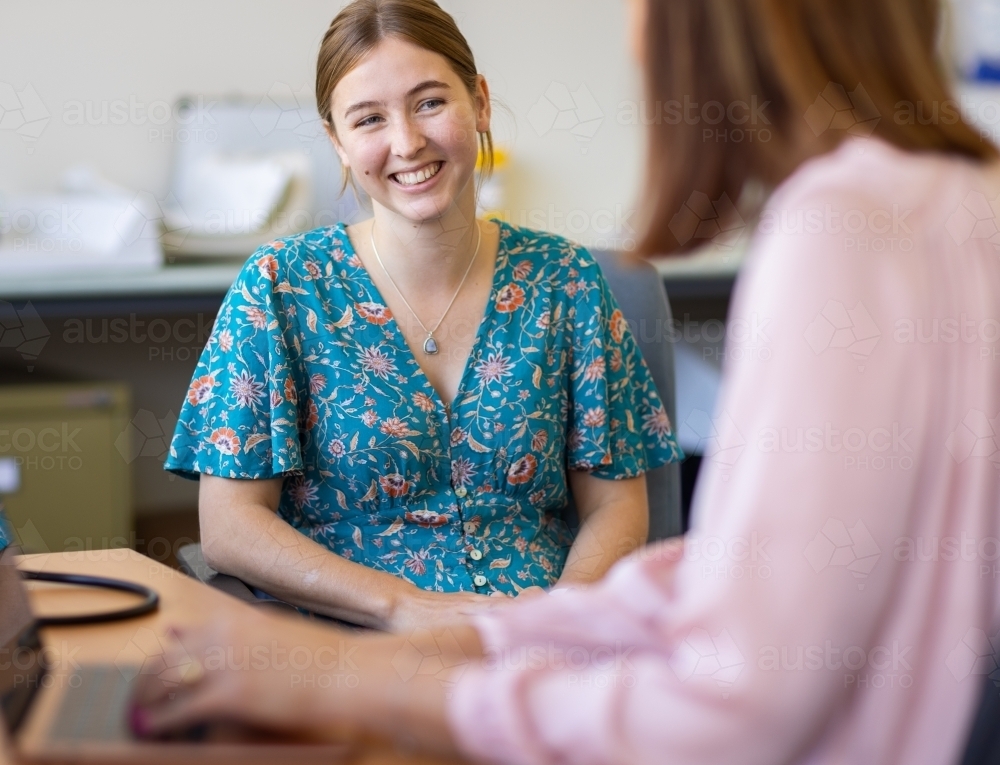Young female at medical appointment in doctors surgery - Australian Stock Image