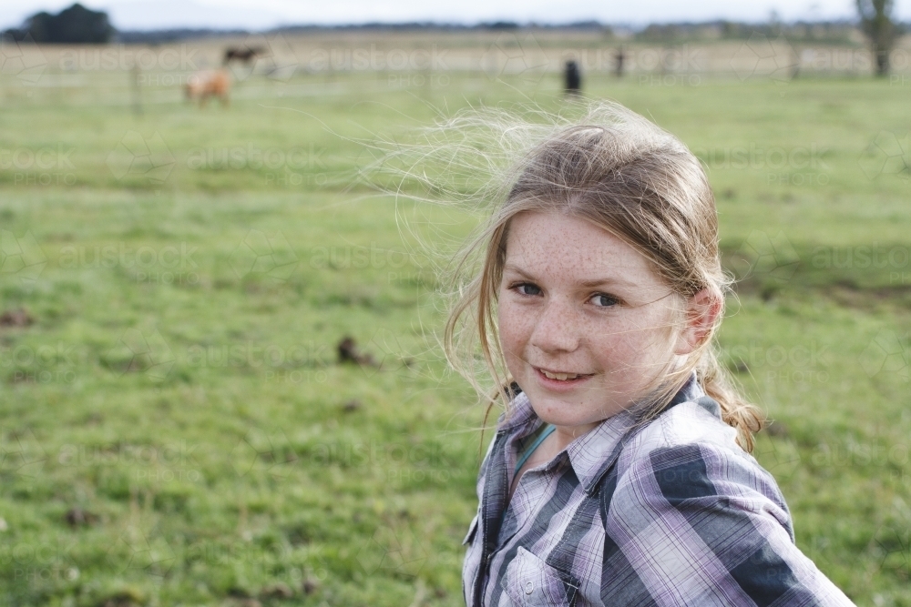 Young girl at horse riding farm - Australian Stock Image