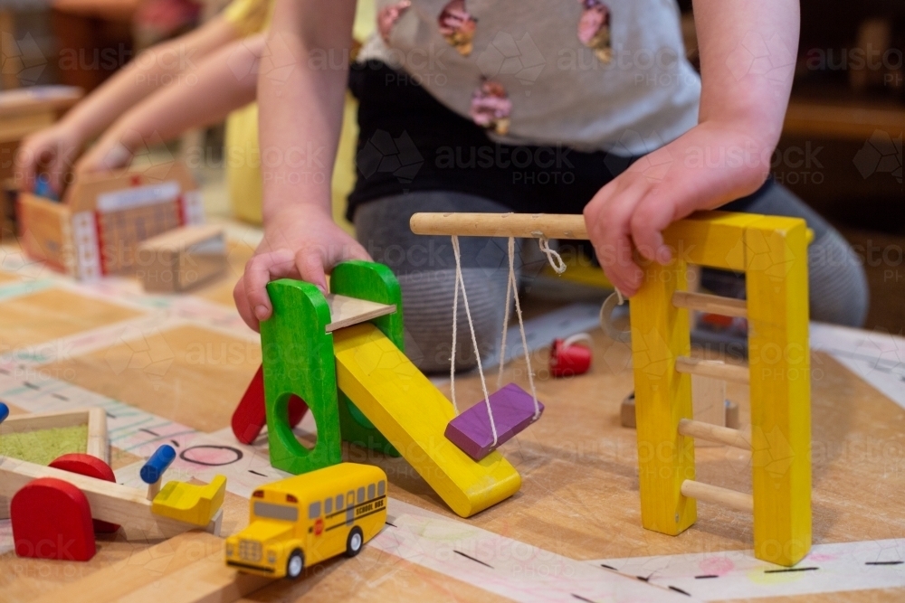 Young girl child playing with building toys - Australian Stock Image