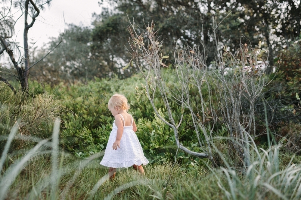 Image Of Young Girl Exploring In The Bush - Austockphoto