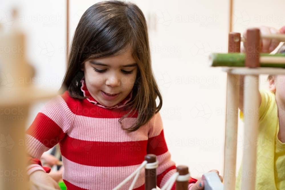 Young girl learning at pre-school - Australian Stock Image