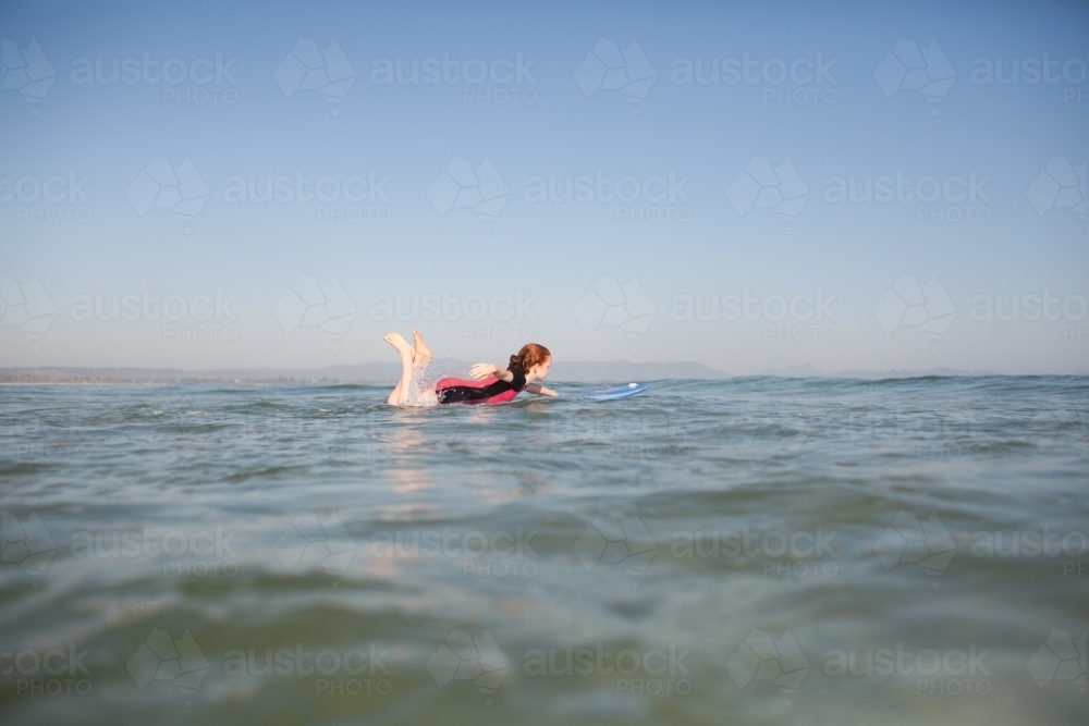 Young girl learning to surf - Australian Stock Image