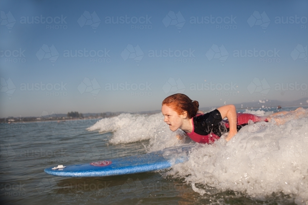 Young girl learning to surf - Australian Stock Image