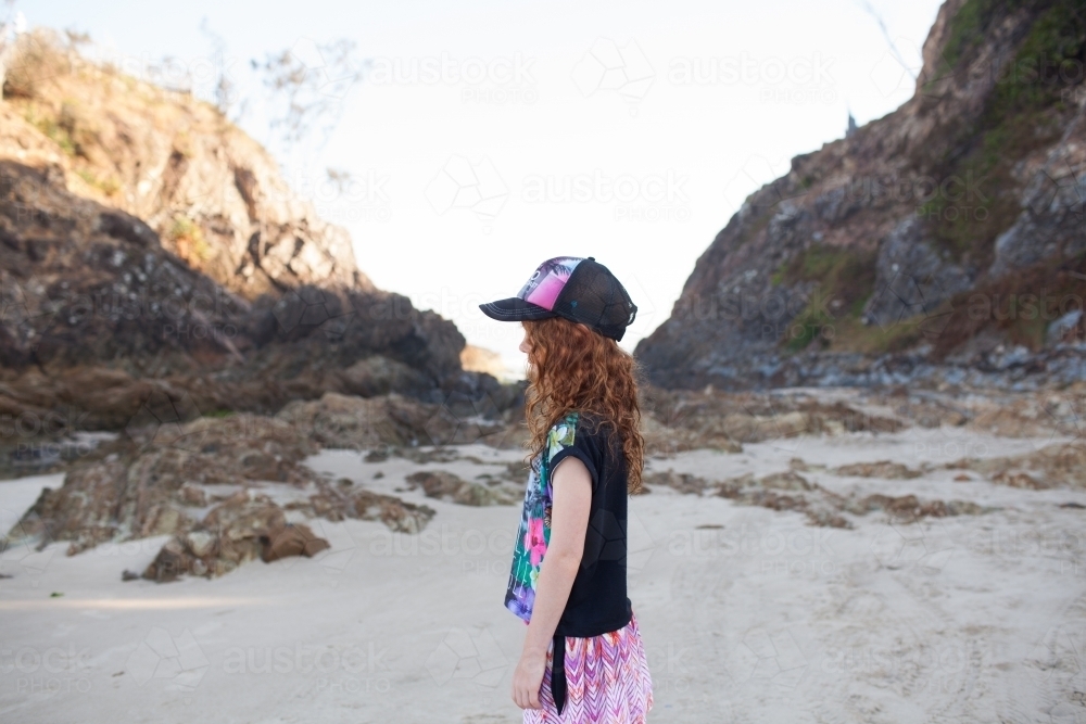Young girl looking sideways at the beach - Australian Stock Image