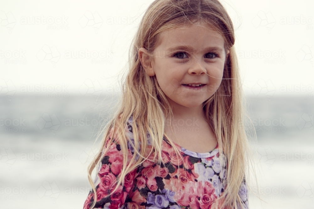 Young girl on beach close up headshot - Australian Stock Image