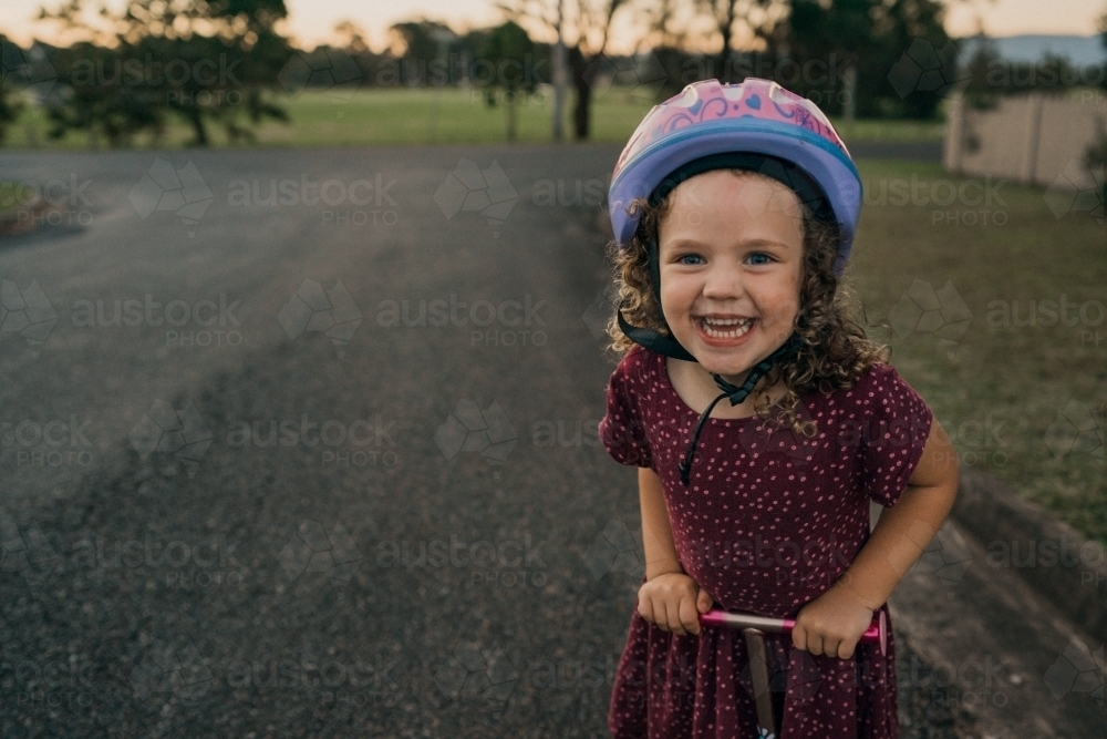 young girl on scooter - Australian Stock Image