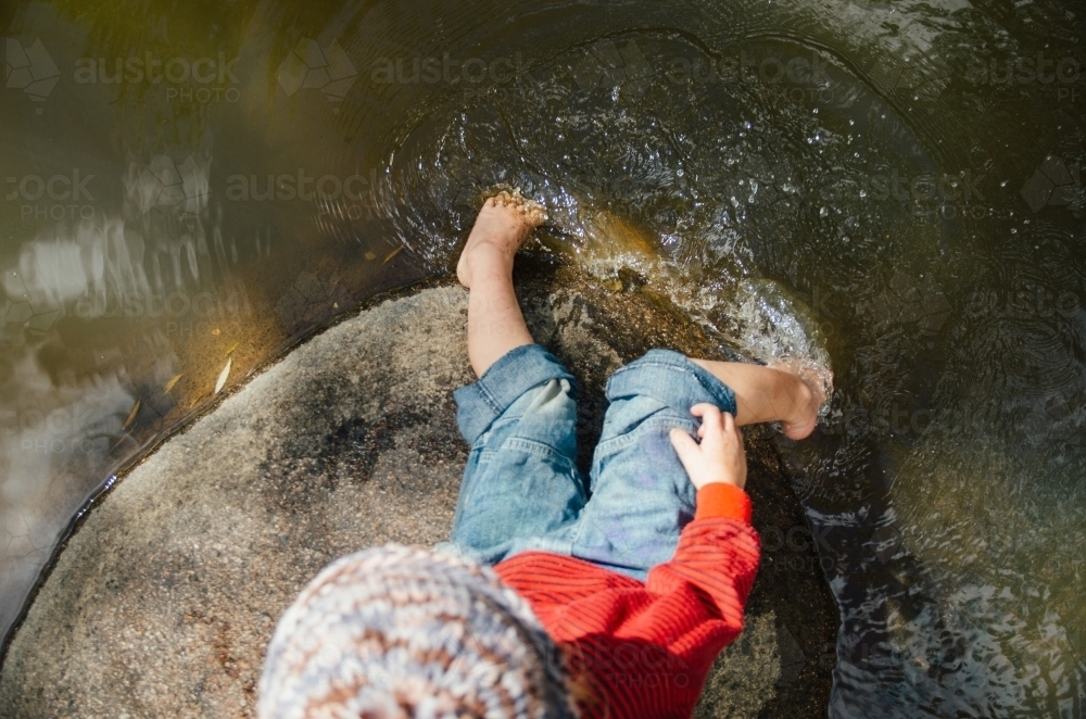 Young girl playing at a lake - Australian Stock Image