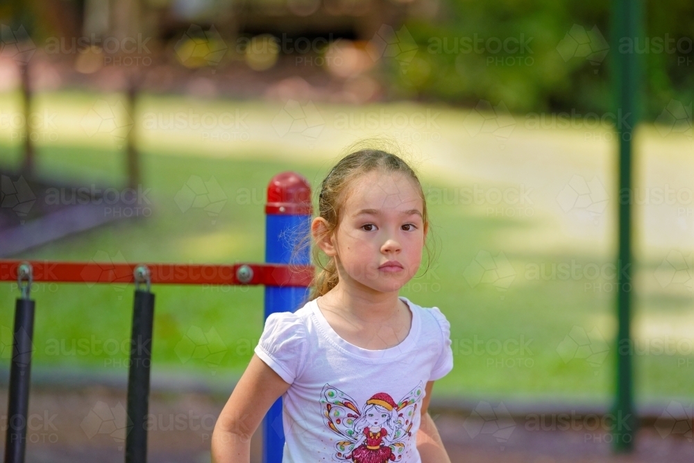 Young girl playing at a play park - Australian Stock Image