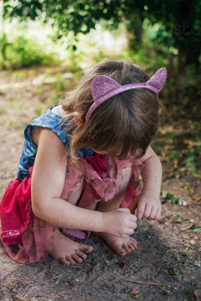 Young girl playing in backyard - Australian Stock Image