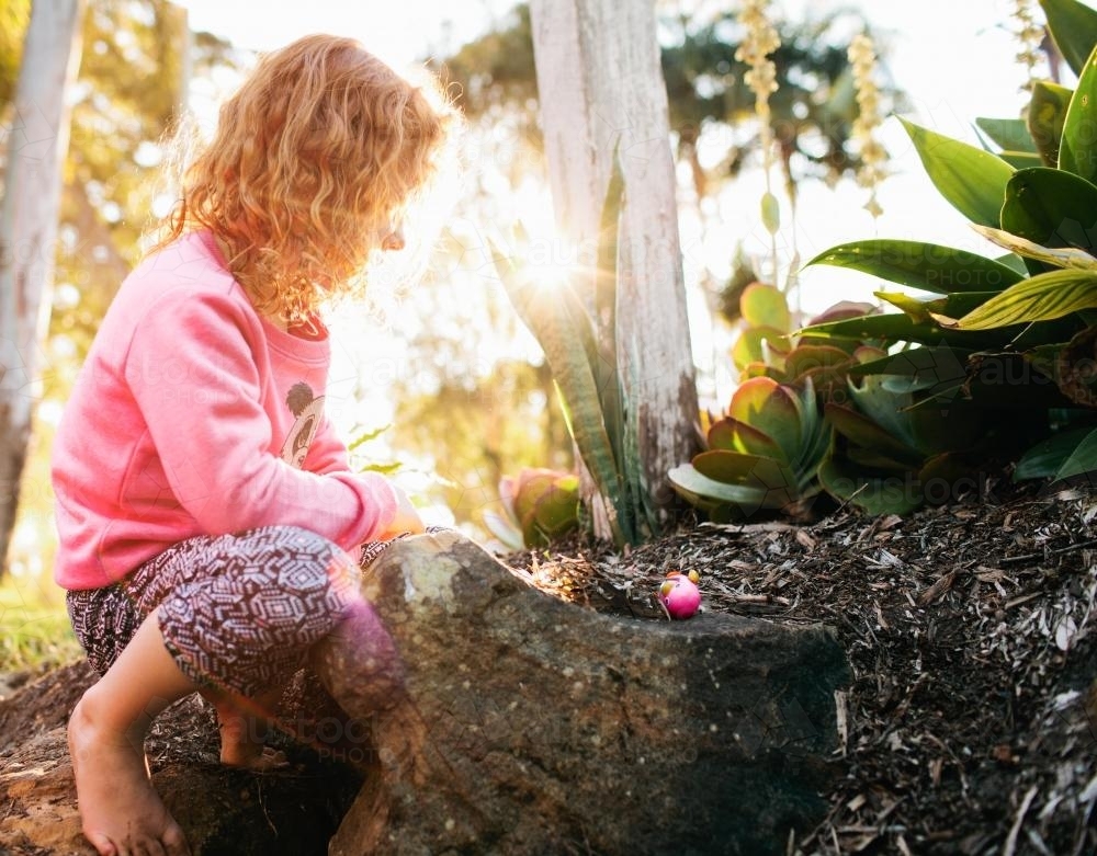 Young girl playing in the dirt - Australian Stock Image