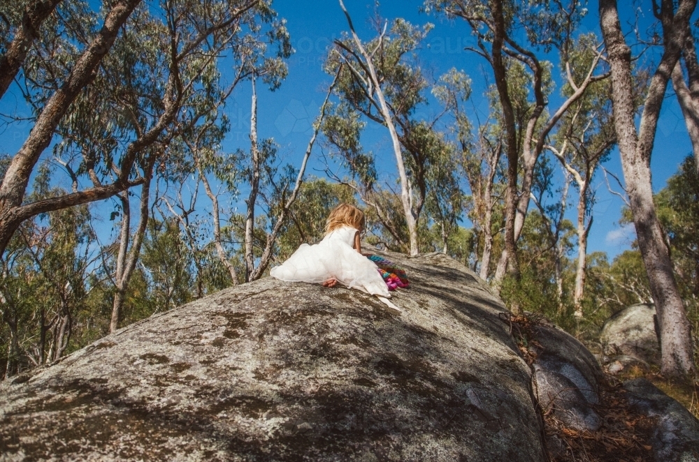 Young girl playing on a rock - Australian Stock Image