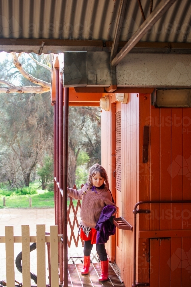 Young girl playing on a vintage train - Australian Stock Image