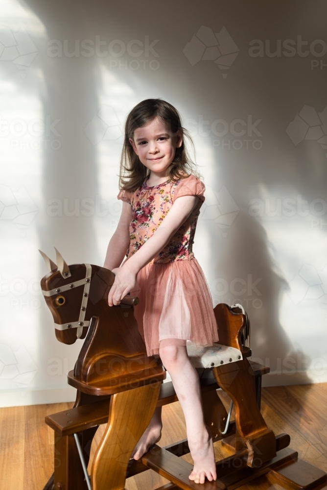 little girl rocking horse