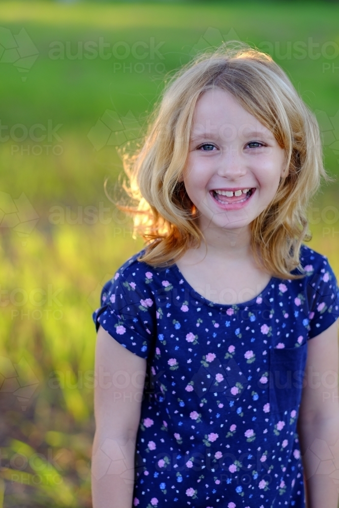 Young girl smiling and laughing - Australian Stock Image