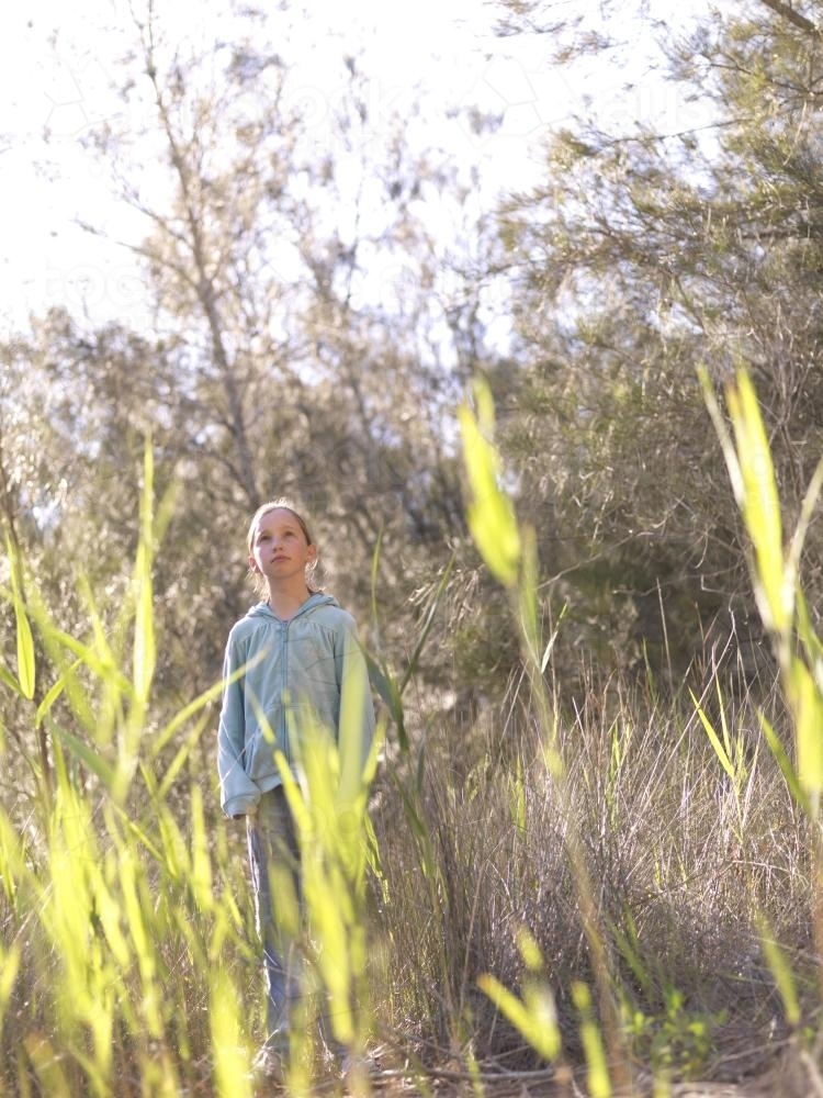 Young girl standing in the bush - Australian Stock Image
