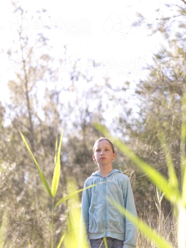 Young girl standing in the bush - Australian Stock Image