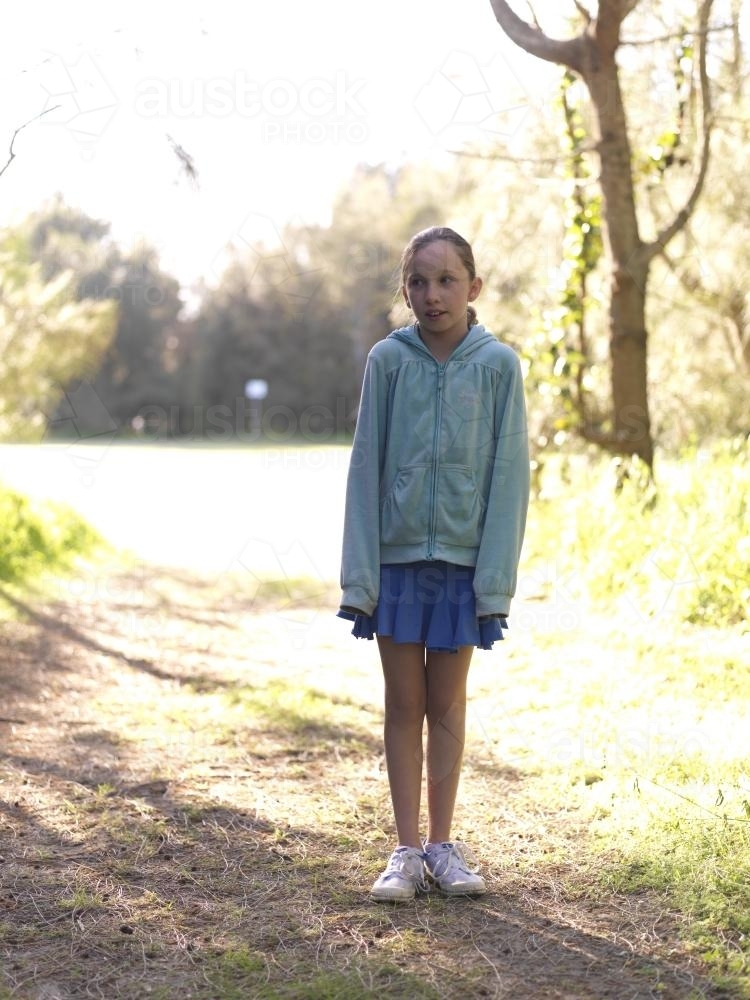 Young girl standing on a bush track - Australian Stock Image
