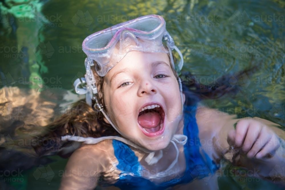 Young girl swimming at Berry Springs - Australian Stock Image