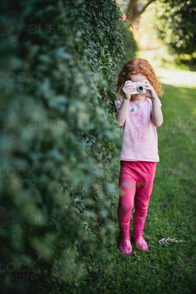 Young girl taking a photo - Australian Stock Image
