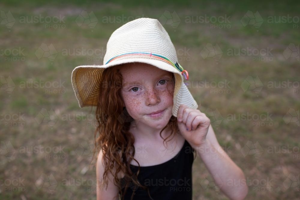 Young girl wearing a floppy hat - Australian Stock Image