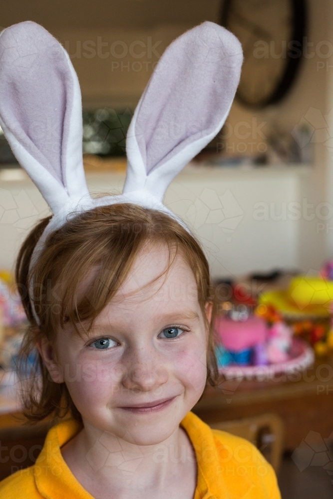 Image of young girl wearing rabbit ears - Austockphoto