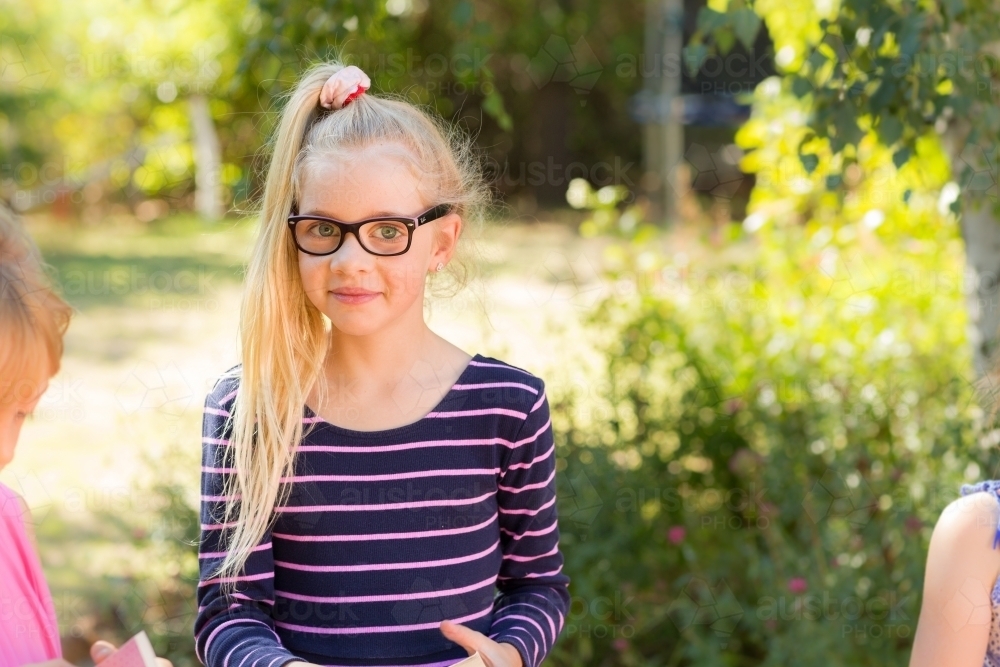 Young girl with long blonde ponytail - Australian Stock Image