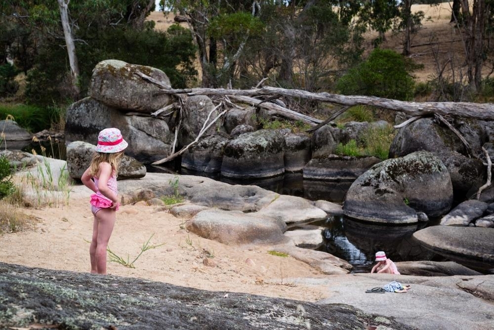 Young girls playing at a swimming hole - Australian Stock Image