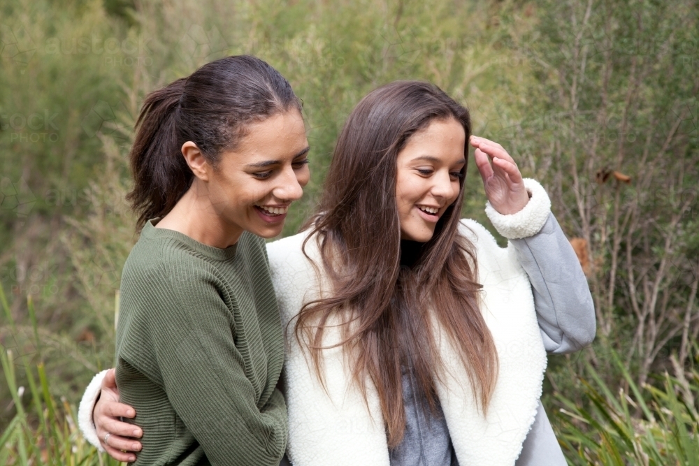 Young happy female friends walking in the bush - Australian Stock Image