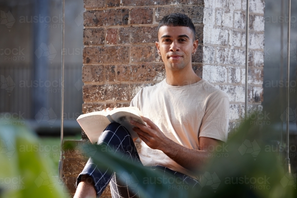 Young Indigenous Australian man enjoying his time outdoors - Australian Stock Image
