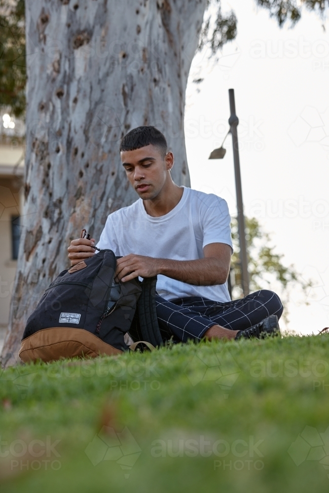 Young Indigenous Australian man enjoying time outdoors - Australian Stock Image