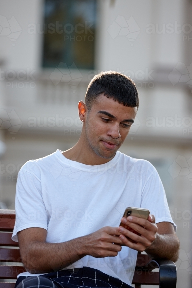 Young Indigenous Australian man enjoying time outdoors - Australian Stock Image