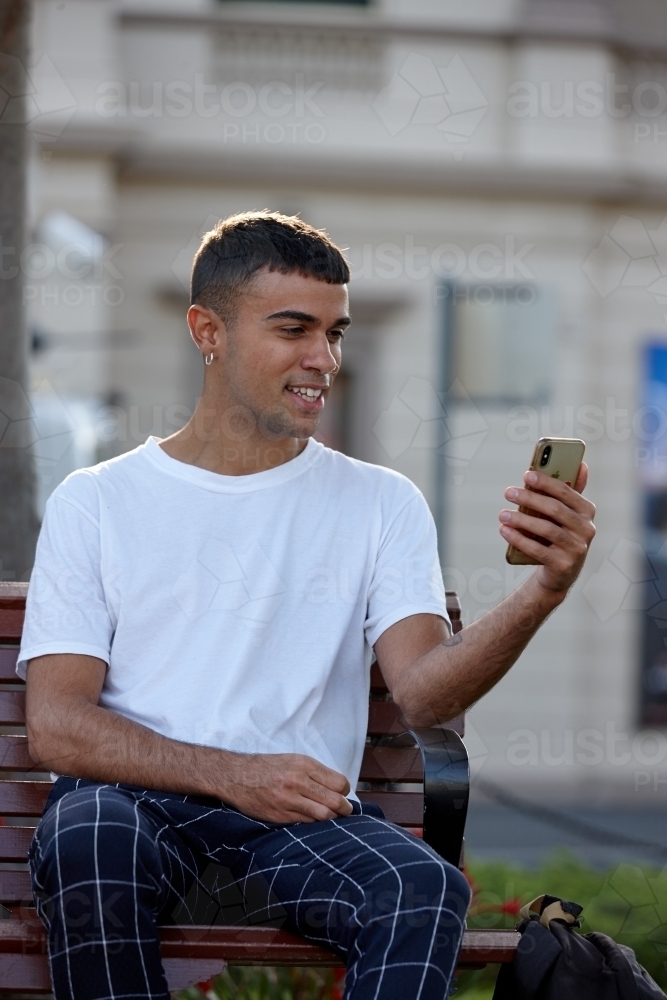 Young Indigenous Australian man enjoying time outdoors - Australian Stock Image