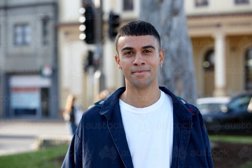 Young Indigenous Australian man enjoying time outdoors - Australian Stock Image
