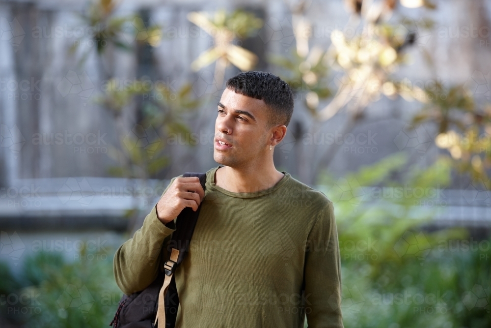 Young Indigenous Australian man enjoying time outdoors - Australian Stock Image