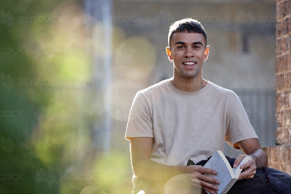 Young Indigenous Australian man enjoying time outdoors - Australian Stock Image