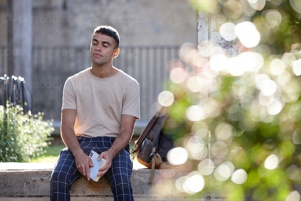 Young Indigenous Australian man enjoying time outdoors - Australian Stock Image