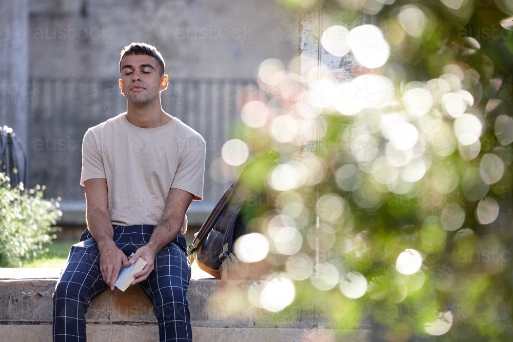 Young Indigenous Australian man enjoying time outdoors - Australian Stock Image