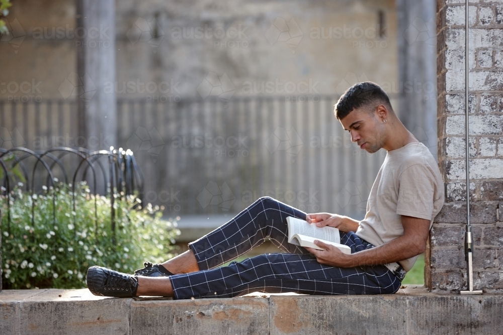 Young Indigenous Australian man enjoying time outdoors - Australian Stock Image