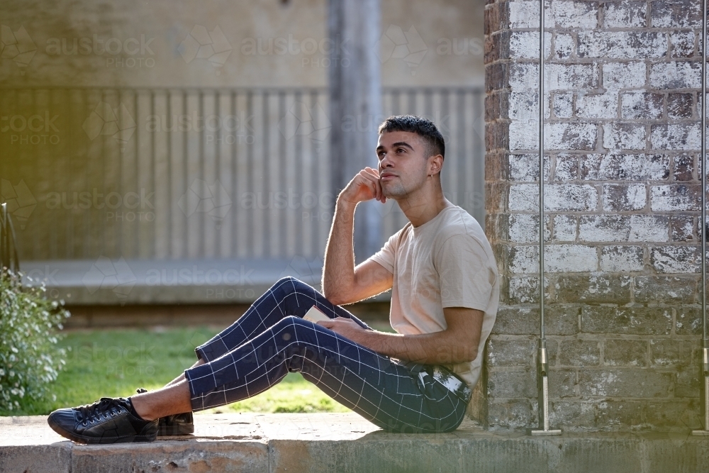Young Indigenous Australian man enjoying time outdoors - Australian Stock Image