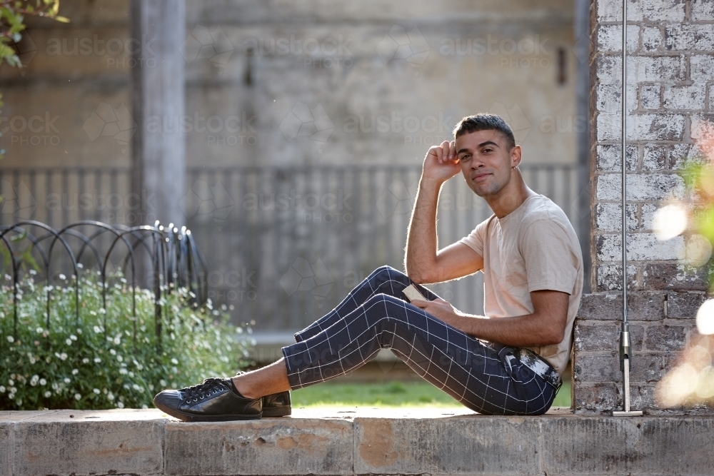 Young Indigenous Australian man enjoying time outdoors - Australian Stock Image