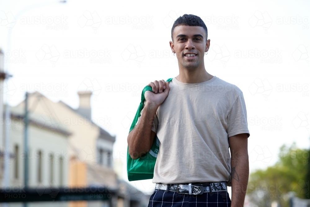 Young Indigenous Australian man enjoying time outdoors - Australian Stock Image