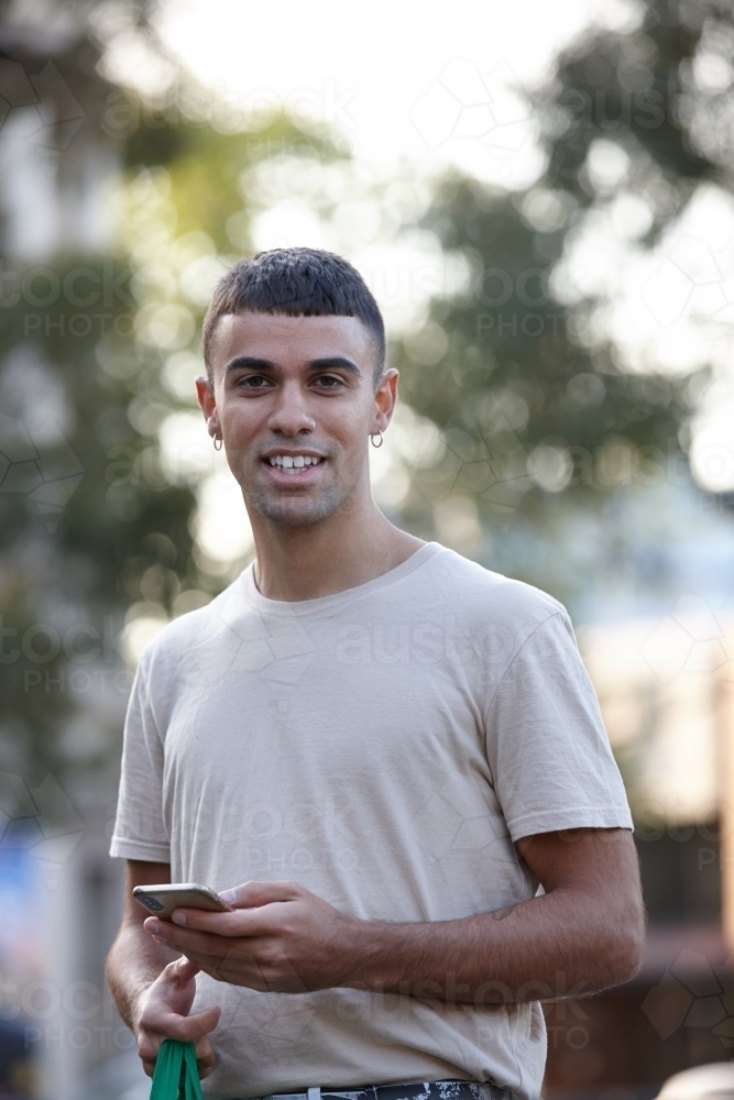Young Indigenous Australian man enjoying time outdoors - Australian Stock Image