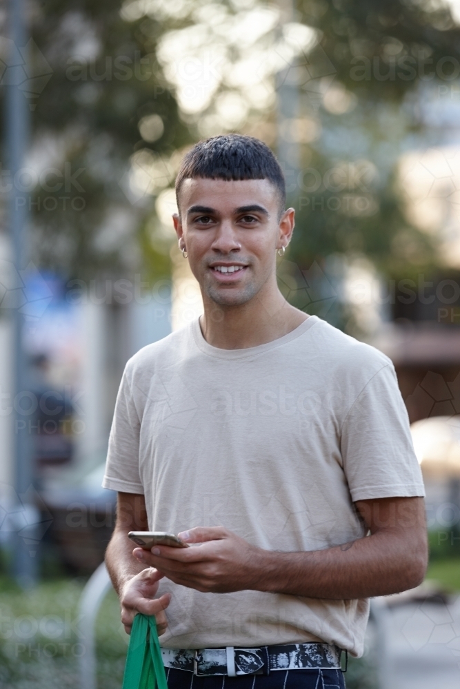 Young Indigenous Australian man enjoying time outdoors - Australian Stock Image