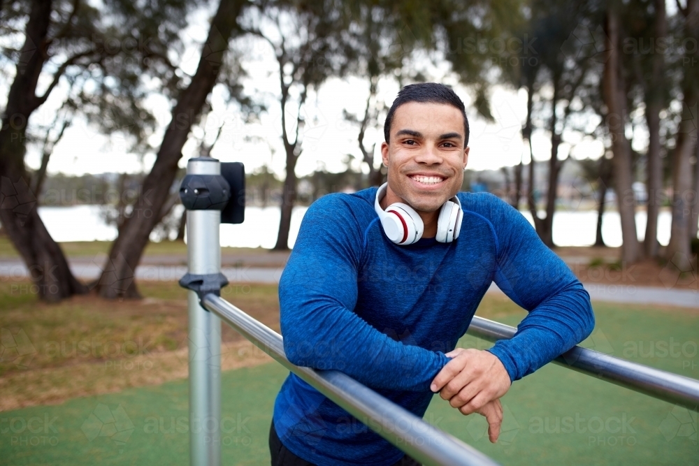 Young Indigenous man working out at park - Australian Stock Image