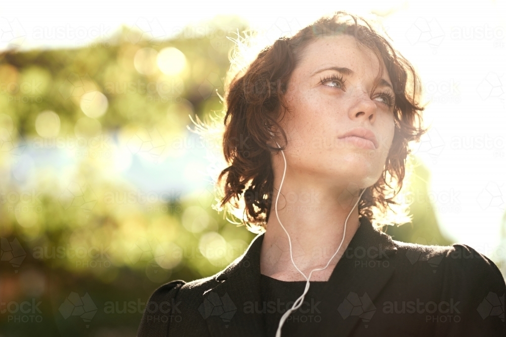 Young lady looking into the distance in the morning - Australian Stock Image